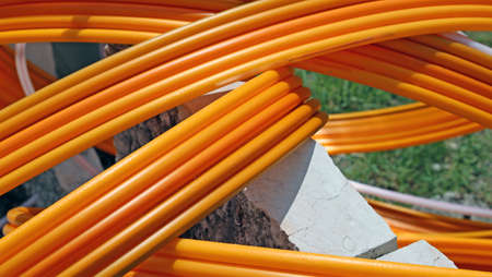 long Orange pipes for fiber optic connection ADSL usersの写真素材