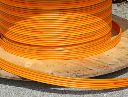 long Orange pipes for fiber optic connection ADSL usersの写真素材