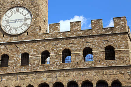 Florence Italy Historic clock tower building called Palazzo Vecchio in the main city squareのeditorial素材