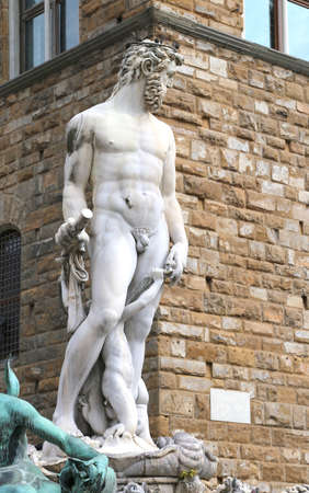 White statue of Neptune in the ancient fountain in Florence Italyのeditorial素材