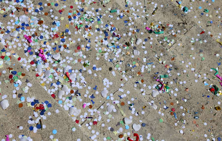 background of confetti and streamers after the great Carnival partyの写真素材