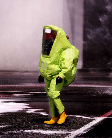 man with yellow protective gear against biological riskの写真素材