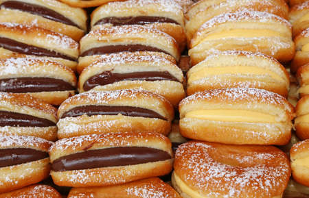 many doughnuts with custard and chocolateの写真素材