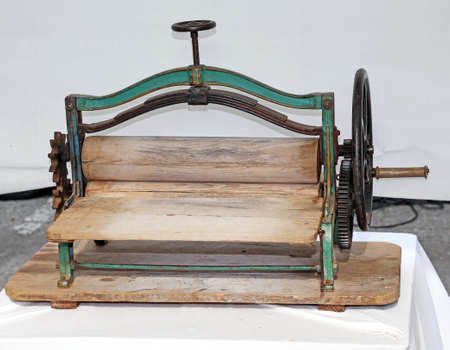 Manual machine once used to dry the clothes after washingの写真素材