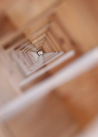 tunnel of large pieces of wood and wooden planks wedged between them