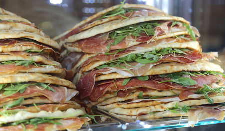 appetizing piadina stuffed for sale in the restaurant in central Italyの写真素材