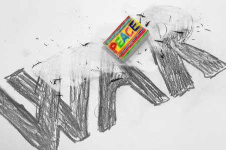Eraser with written PEACE deletes the WARの写真素材