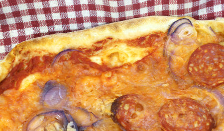 good pizza cooked in the wood oven pizzeria in Italyの写真素材