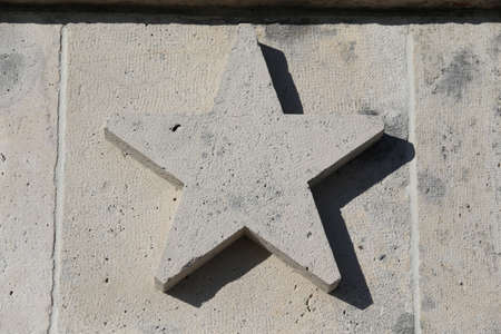 large five-pointed star carved in stoneの写真素材