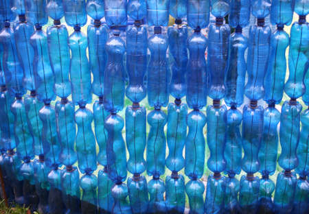 many blue plastic bottles to recycleの写真素材