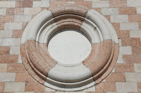 Big circle in the brick wall in the ancient european