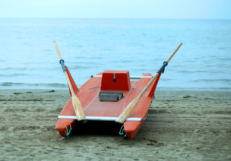 rescue boat rowing for lifeguard on the shore of the sea