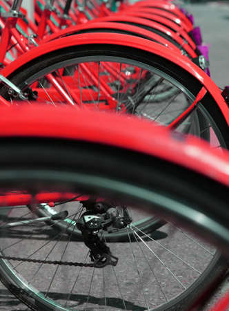 red bicycles in the bicycle rack of the urban bike-sharing system to move into ecologically cityの写真素材