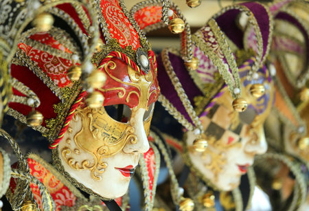 Venice Italy golden and red carnival mask during festivitiesの写真素材