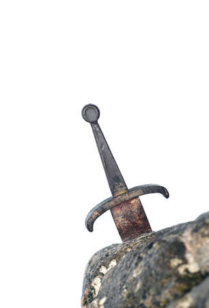 legendary Excalibur sword into the stone in the middle of the forest in winterの写真素材