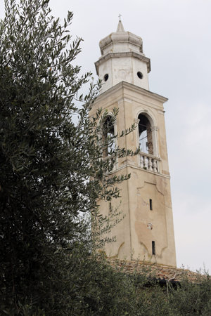 large ancient Bell Tower of the village LAZISE on Garda Lake in Italyの写真素材