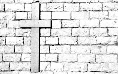 symbol of the cross carved on marble attached to the stone wallの写真素材