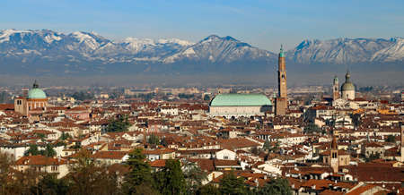 Vicenza, Italy, skyline of the city with Basilica Palladiana, houses, landmarks and Monte Summano in backgroundのeditorial素材