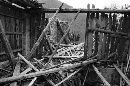 wooden planks and rubble and the ruins of the house completely destroyed by powerful earthquakeの写真素材