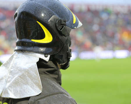 firefighters with hardhat in riot gear during the sports eventの写真素材
