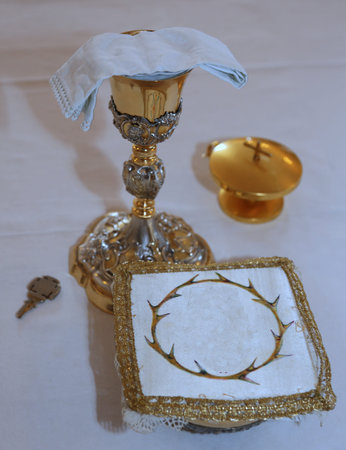 Golden Chalice in the altar of a Christian Church during Holy Massの写真素材