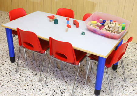 kindergarten  with wooden toys on the tableの写真素材
