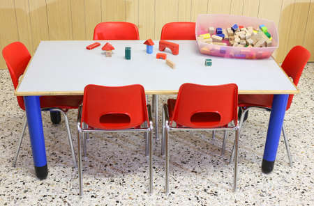 Nursery classroom with wooden toys on the tableの写真素材