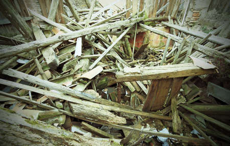 wooden planks and rubble and the ruins of the house completely destroyed by powerful earthquakeの写真素材