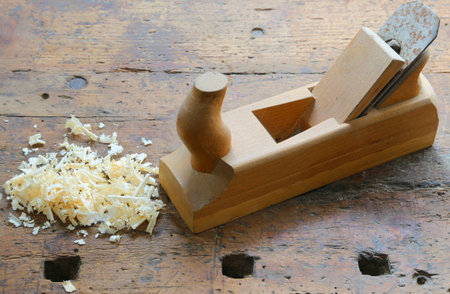 Planer with sawdust on the woodworking craft Workbench