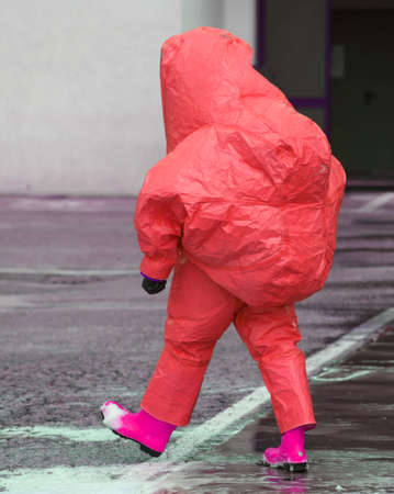 man with red protective gear against biological riskの写真素材