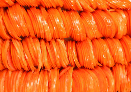 many Italian red tomato slices in the pizza restaurant in Romeの写真素材