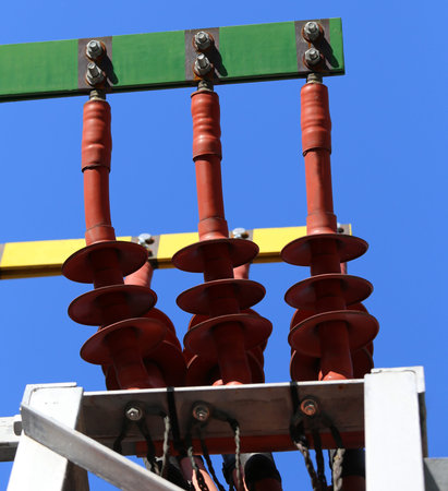 big copper busbar with high-voltage cables in an electric power plant