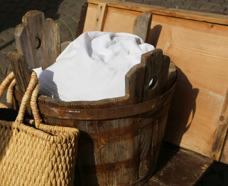 old wooden tub for washing clothes and doing laundry by handの写真素材