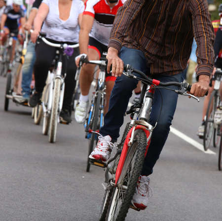 many cyclists use the bike into town to get around without pollutingの写真素材