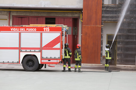italian fire engine pulled up in front of the blazing building
