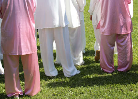 martial arts Tai Chi train with movements to find the right positions in the public parkの写真素材