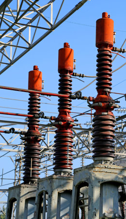 three giant breakers in the electrical substation of the hydroelectric plant outdoors