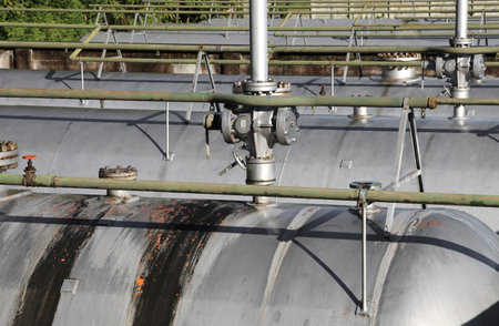 many steel safety valves over the container under full pressure of flammable gas