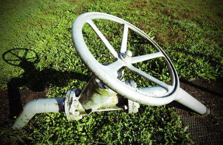 big equipment circular shape for maneuvering the valve for closing or opening of the underground...