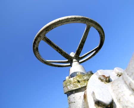 huge equipment circular shape for maneuvering the valve for closing or opening of the underground pipeline in an industrial plant of a multiutility company.の写真素材