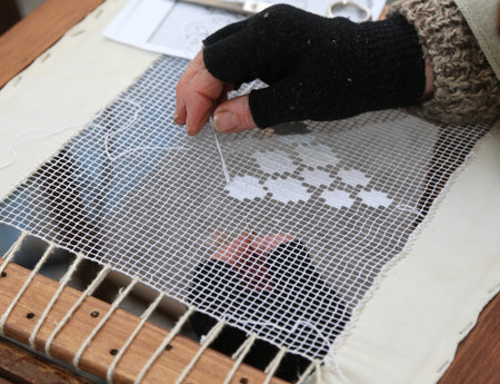 old woman of the south italy with the black glove embroidered with white thread and frame