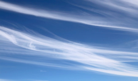 white cirrostratus in the blue sky after the storms in summer