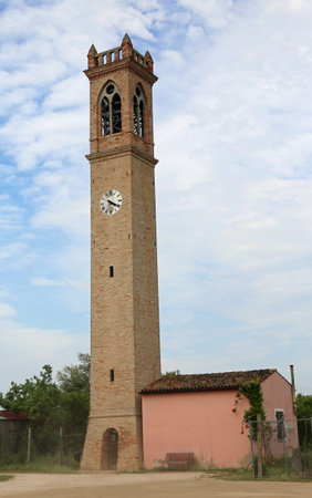 church tower with clock in the site called Lio Piccolo near Venice in Italyの写真素材