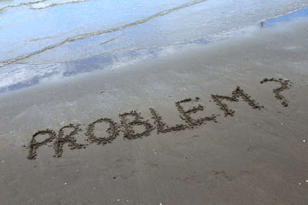 PROBLEM written on the beach in summerの写真素材