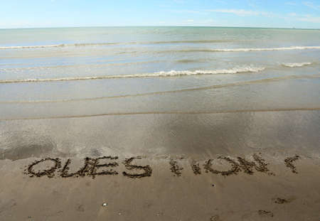 QUESTIONS big written on the sandy beachの写真素材