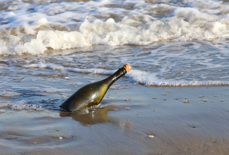 Secret Message in the glass bottle on the beach