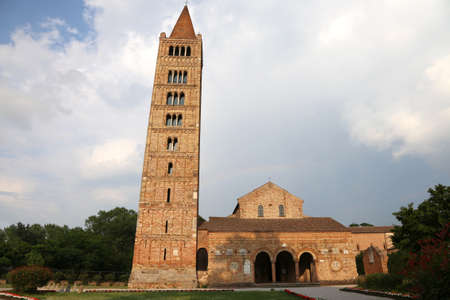 highest ancient Bell Tower of the Abbey of Pomposa historic building in the Po Valley near Ferrara in Italyのeditorial素材