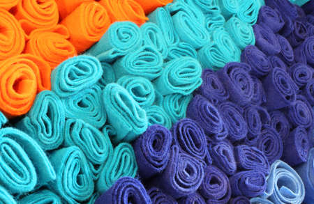 Many rolls of colored felt for saleの写真素材