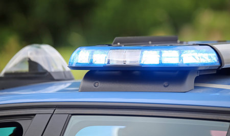 technological blue flashing of the police car during a chase between cars