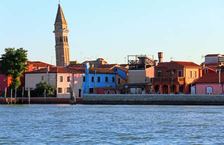 Adriatic Sea and the small island of Burano with colorful houses and the leaning bell tower near Venice in Italyの写真素材